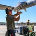 South Dakota Air Guardsmen load munitions on F-16s