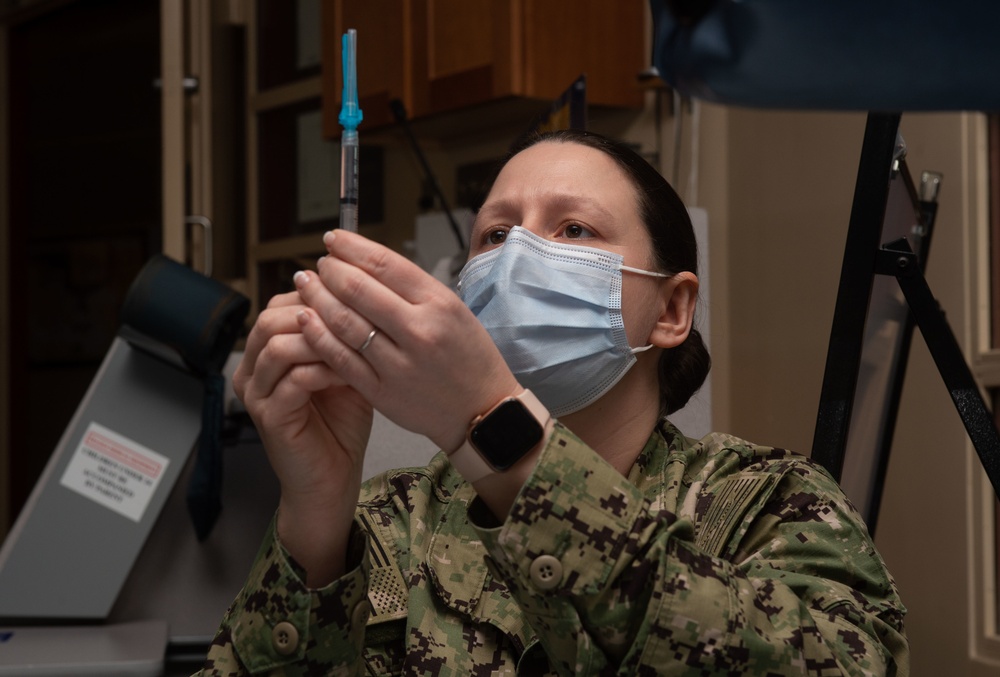 Sailor prepares vaccine
