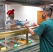 Team Hill leadership serve dinner the members of Hill's Hearts Apart Program.