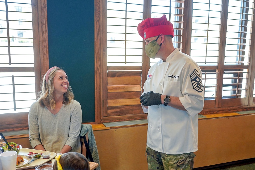 Team Hill leadership serve dinner the members of Hill's Hearts Apart Program.