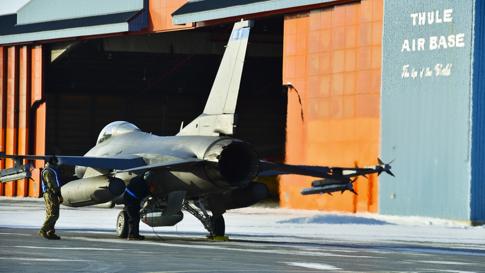 U.S. Air Force Airmen from the 148th Aircraft Maintenance Squadron recover an F-16 at Thule Air Base, Greenland during Amalgam Dart 21-2