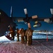 U.S. Air Force Airmen from the 148th Fighter Wing step onto a C-130 in Yellowknife, Canada preparing to forward-deploy