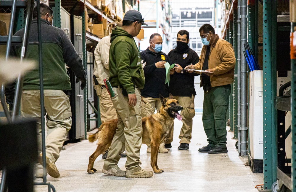 U.S. Customs and Border Protection Patrol K-9 Agents conduct narcotics detection training hosted by Maritime Expeditionary Security Group (MESG) 1 Training Evaluation Unit.