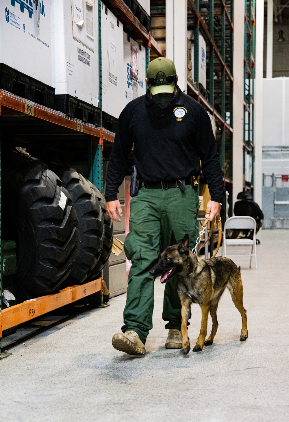 U.S. Customs and Border Protection Patrol K-9 Agents conduct narcotics detection training hosted by Maritime Expeditionary Security Group (MESG) 1 Training Evaluation Unit.