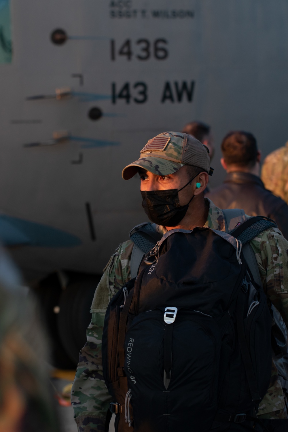 C130J Hercules crew debark at sunset