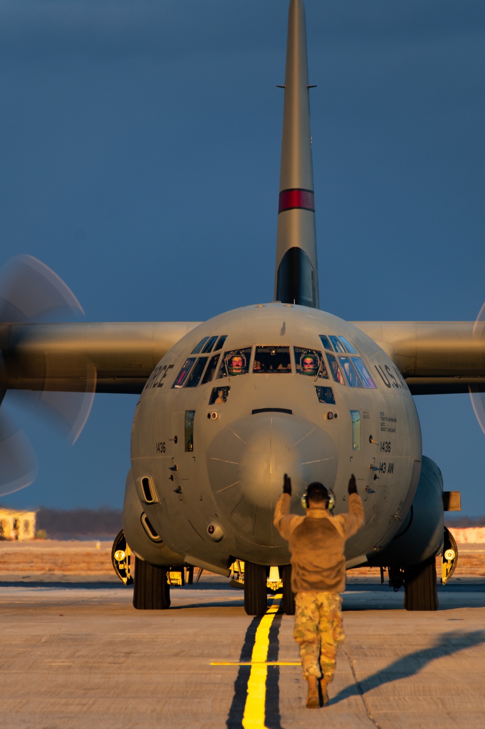 C130J Hercules crew debark at sunset
