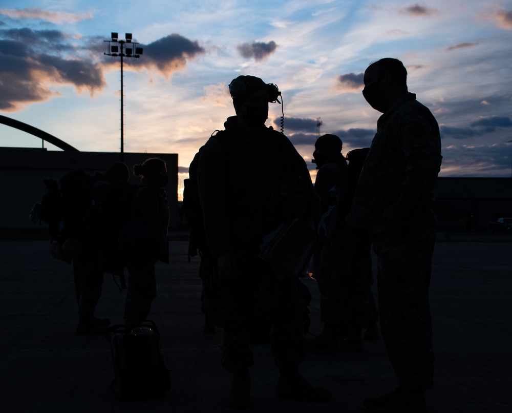 C130J Hercules crew debark at sunset