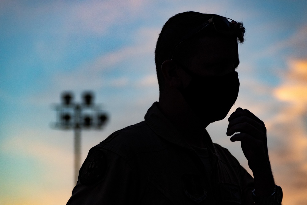 C130J Hercules crew debark at sunset