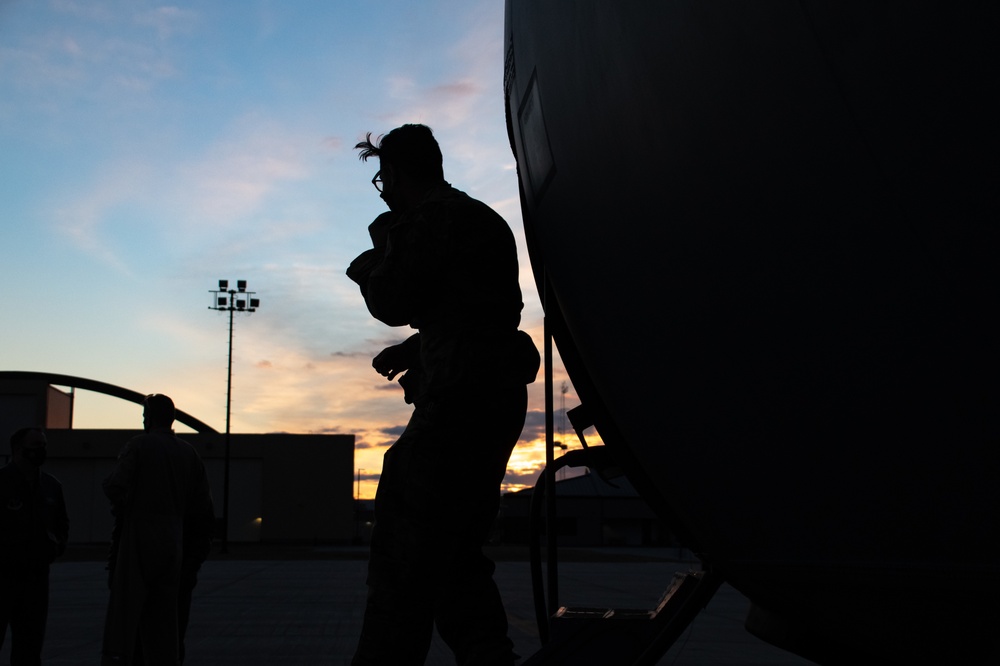 C130J Hercules crew debark at sunset