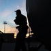 C130J Hercules crew debark at sunset