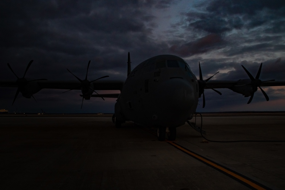 C130J Hercules crew debark at sunset