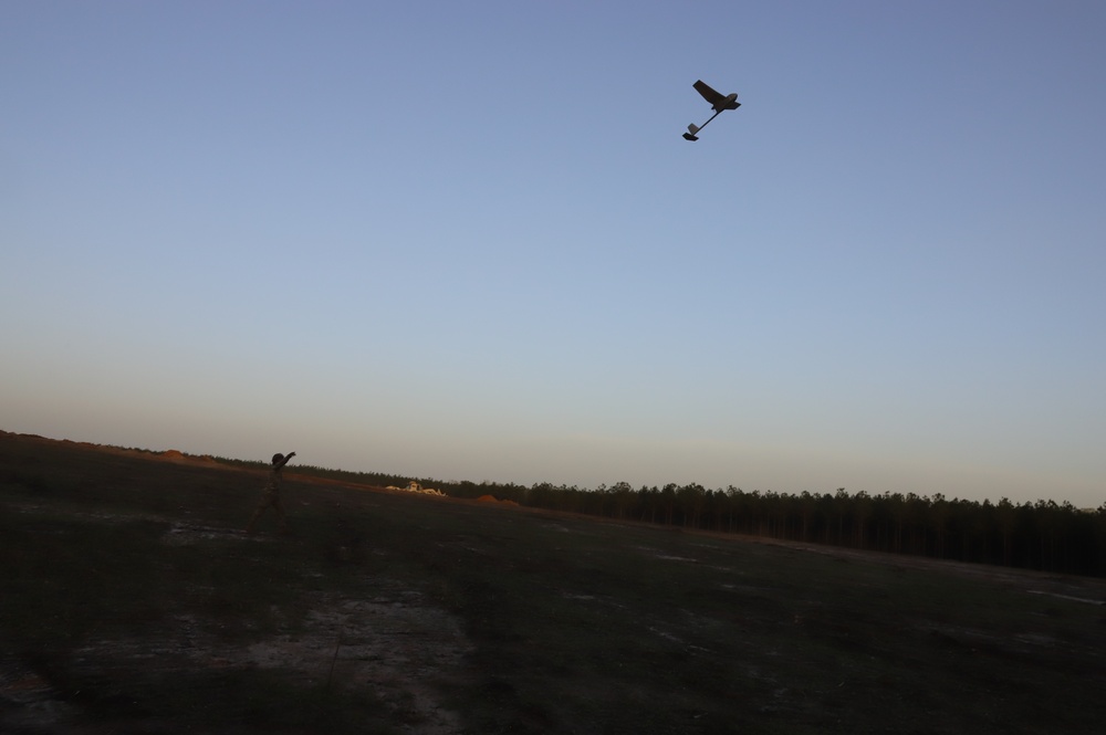 1st Brigade Combat Team 82nd Airborne Division Soldier launces Raven glider at sunset