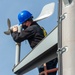 Sailors Install a Wind Bird Aloft