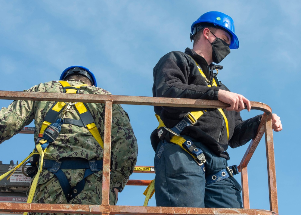 Sailors Install a Wind Bird Aloft