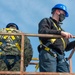 Sailors Install a Wind Bird Aloft