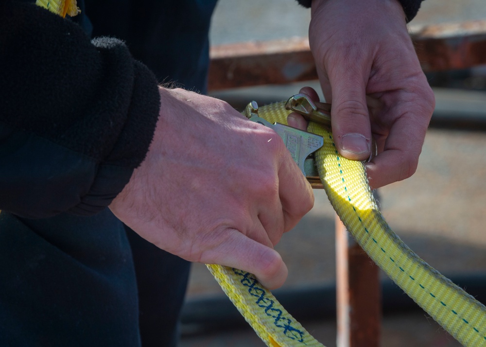 Sailors Install a Wind Bird Aloft