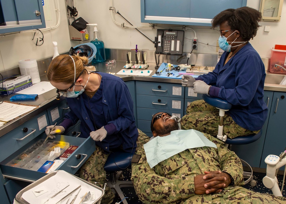 Saliors perform dental cleaning