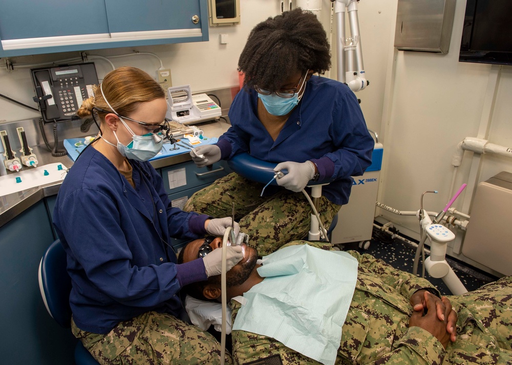 Saliors perform dental cleaning