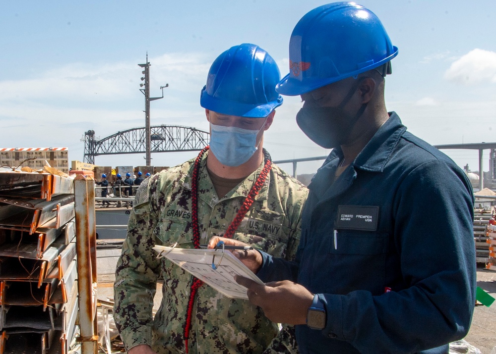 Sailors Conduct Mainentance On Flight Deck