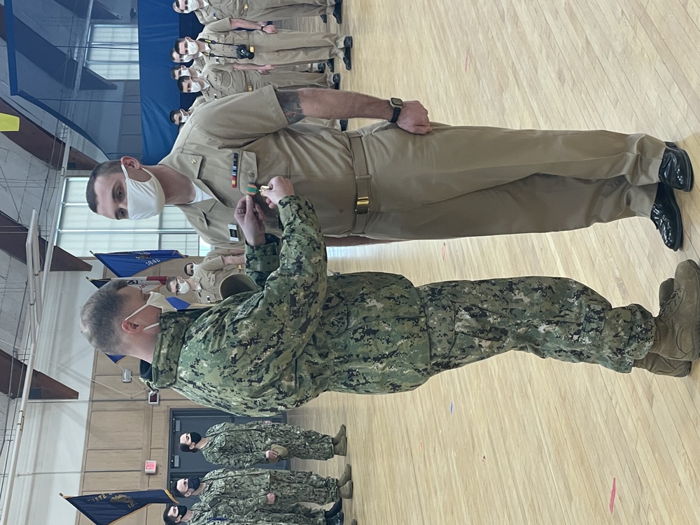 210317-N-ZZ999-0001 NEWPORT, R.I. (March 17, 2021) Officer Candidate Tyler Zutell earns the Navy and Marine Corps Achievement Medal after saving shipmate's life