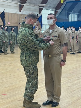 210317-N-ZZ999-0001 NEWPORT, R.I. (March 17, 2021) Officer Candidate Tyler Zutell earns the Navy and Marine Corps Achievement Medal after saving shipmate's life