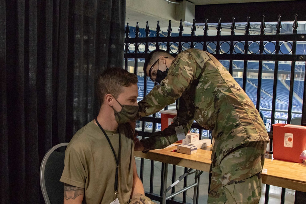 U.S. Air Force Airmen conduct vaccination training at Ford Field CVC