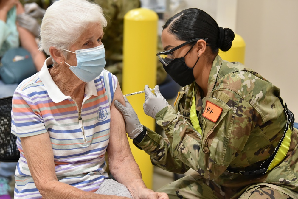 MEDCoE Soldiers administer COVID-19 vaccines, helping to win the pandemic war