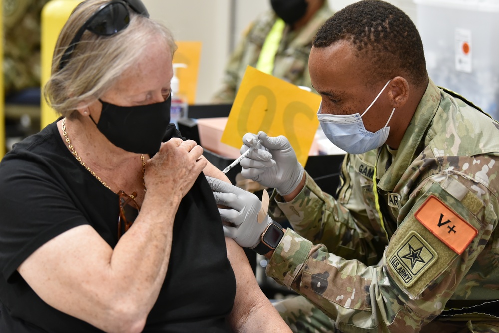 MEDCoE Soldiers administer COVID-19 vaccines, helping to win the pandemic war