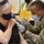 MEDCoE Soldiers administer COVID-19 vaccines, helping to win the pandemic war