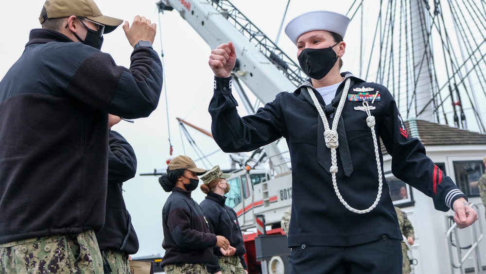 Boatswain’s Mate 2nd Class Jacklyn Ditzel bids farewell to the officers and crew of Constitution