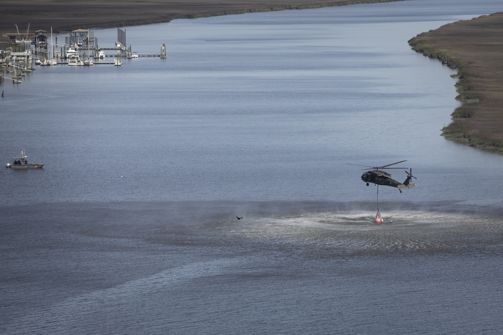 3rd Combat Aviation Brigade works with the U.S. Coast Guard to recover displaced buoys.
