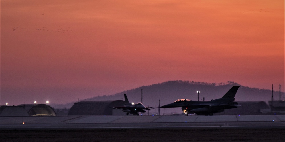 Wolf Pack F-16s take off at dawn