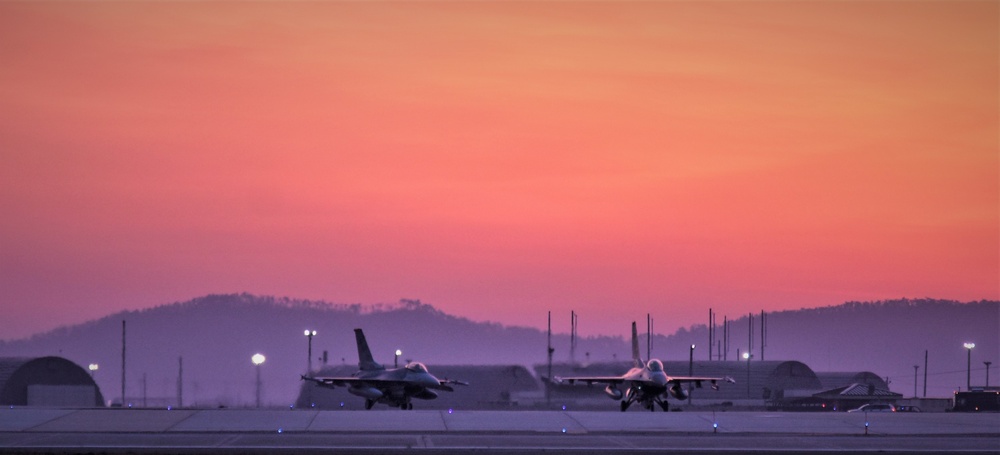 Wolf Pack F-16s take off at dawn