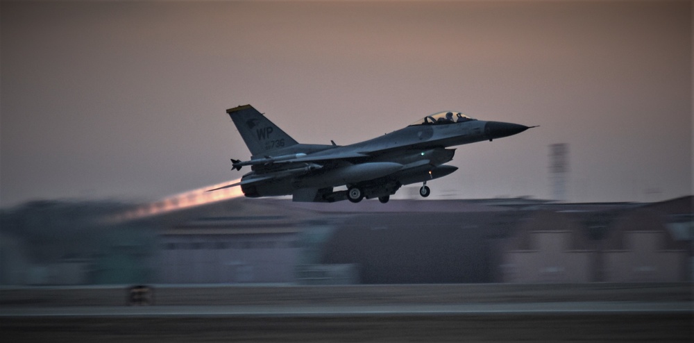 Wolf Pack F-16s take off at dawn