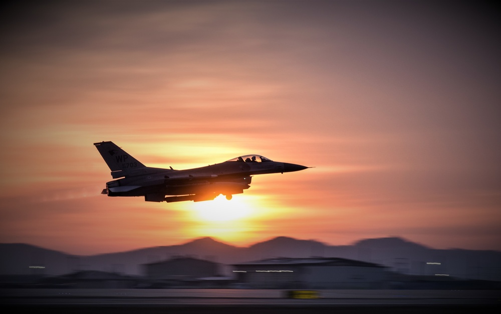 Wolf Pack F-16s take off at dawn