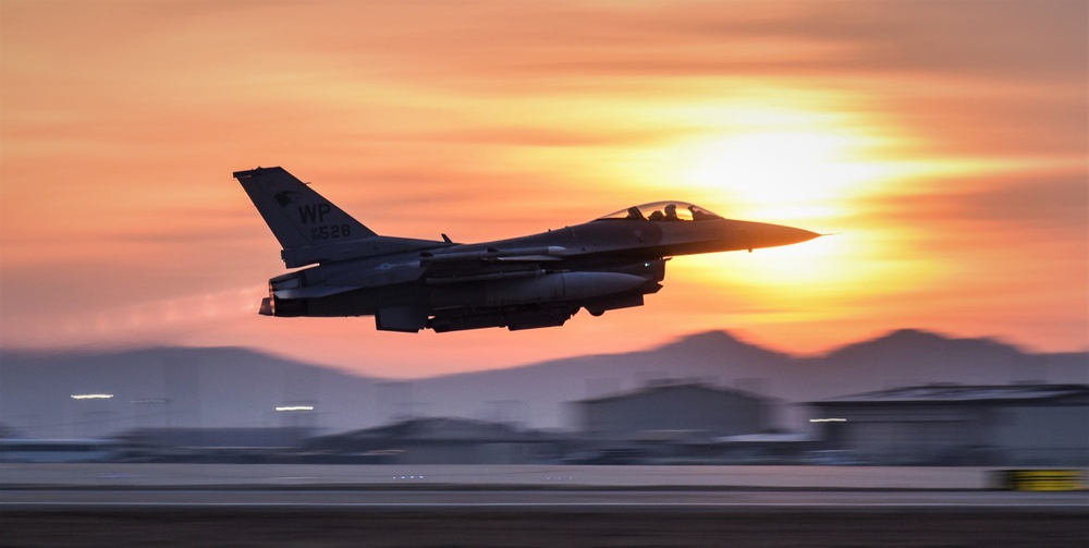 Wolf Pack F-16s take off at dawn