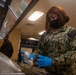 Sailor cleaning Mess deck