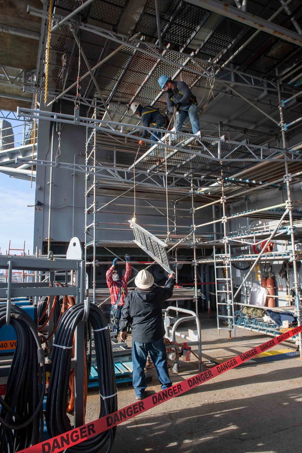 Contractors construct a rigging platform