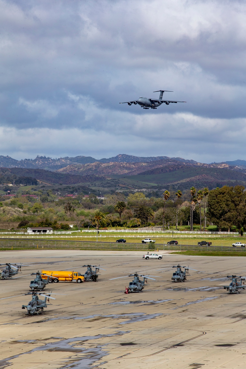 Marines, airmen load helicopters into Super Galaxy for deployment