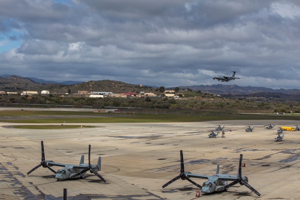 Marines, airmen load helicopters into Super Galaxy for deployment