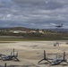 Marines, airmen load helicopters into Super Galaxy for deployment