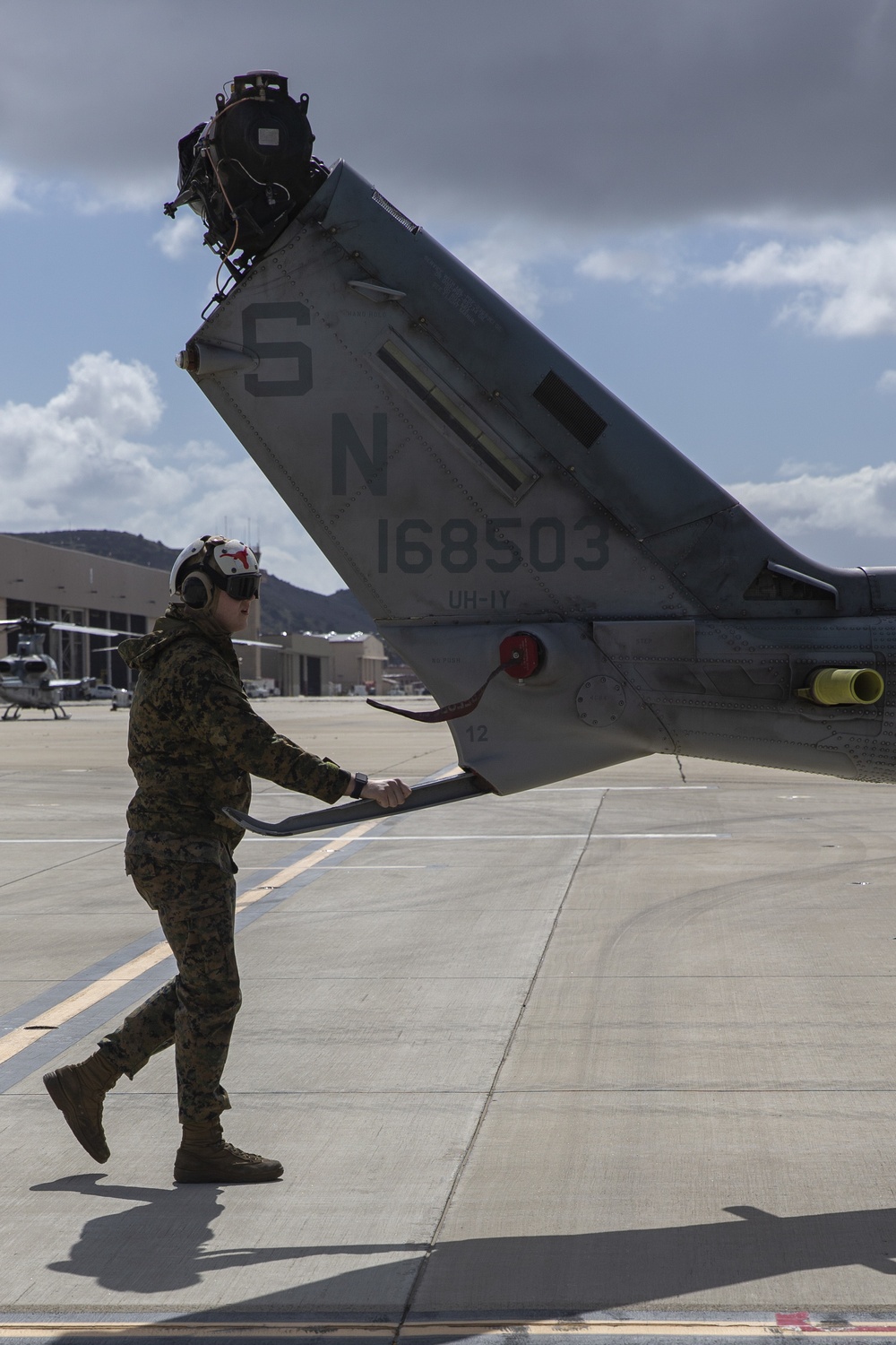 Marines, airmen load helicopters into Super Galaxy for deployment