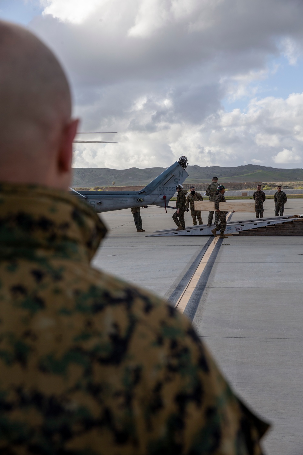Marines, airmen load helicopters into Super Galaxy for deployment