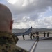 Marines, airmen load helicopters into Super Galaxy for deployment