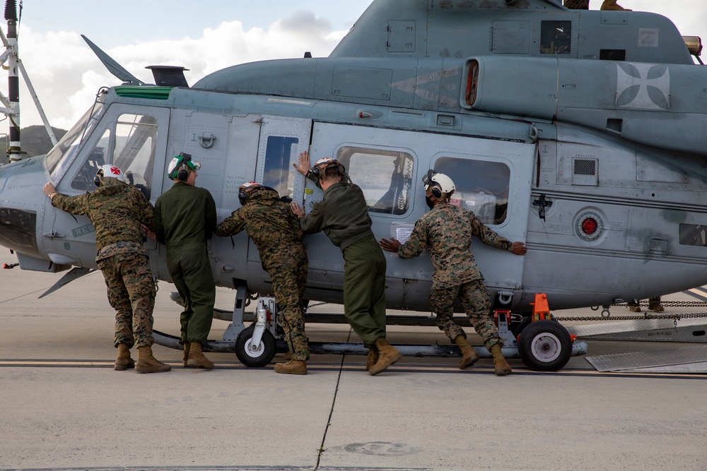 Marines, airmen load helicopters into Super Galaxy for deployment