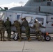 Marines, airmen load helicopters into Super Galaxy for deployment