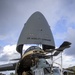 Marines, airmen load helicopters into Super Galaxy for deployment