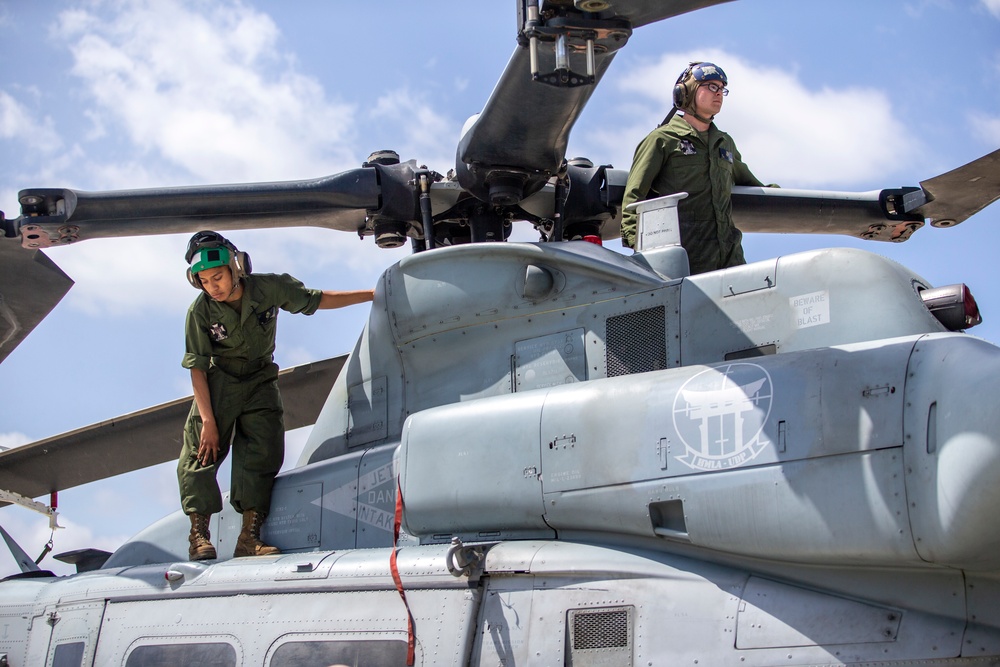 Marines, airmen load helicopters into Super Galaxy for deployment