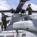 Marines, airmen load helicopters into Super Galaxy for deployment