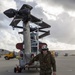 Marines, airmen load helicopters into Super Galaxy for deployment